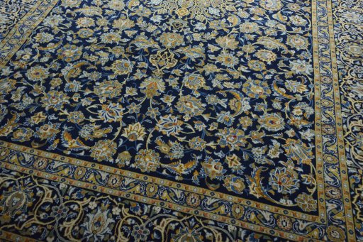 Close-up detail of 2000s Kashan rug from Iran / Persia showing Wool weave