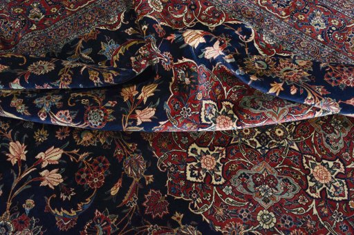Surface texture of 1930s Kashan rug with natural Wool and intricate pattern