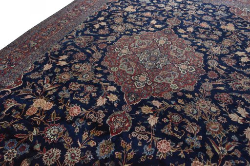 Backside of handmade 1930s Kashan rug showing knot structure and weave density