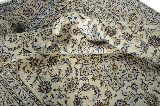 Surface texture of 2000s Kashan rug with natural Wool and intricate pattern