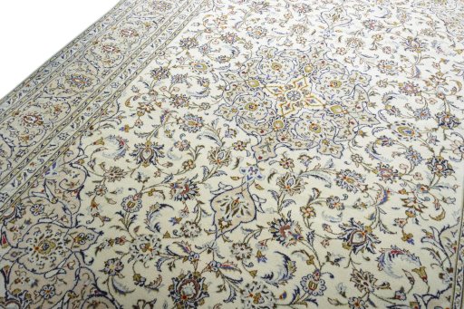 Backside of handmade 2000s Kashan rug showing knot structure and weave density
