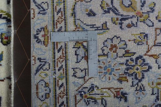 Surface texture of 2000s Kashan rug with natural Wool and intricate pattern