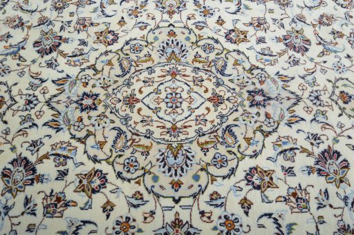 Backside of handmade 2000s Kashan rug showing knot structure and weave density