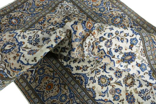 Surface texture of 2000s Kashan rug with natural Wool and intricate pattern