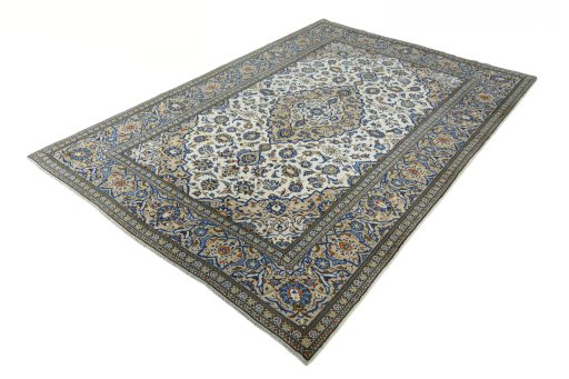 Corner detail of 2000s Kashan rug showing border pattern and Wool pile