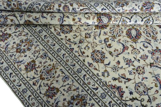 Close-up detail of 2000s Kashan rug from Iran / Persia showing Wool weave