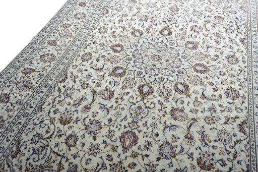 Backside of handmade 2000s Kashan rug showing knot structure and weave density