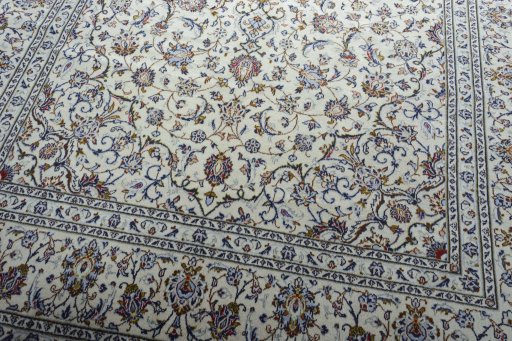 Close-up detail of 2000s Kashan rug from Iran / Persia showing Wool weave