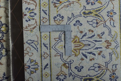 Backside of handmade 2000s Kashan rug showing knot structure and weave density