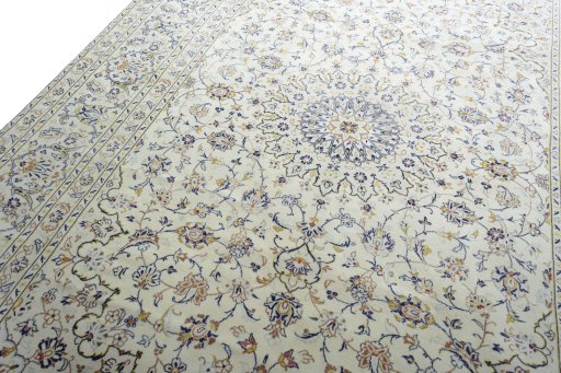 Backside of handmade 2000s Kashan rug showing knot structure and weave density