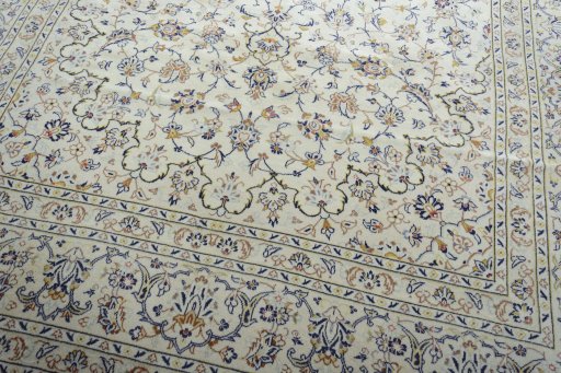 Close-up detail of 2000s Kashan rug from Iran / Persia showing Wool weave