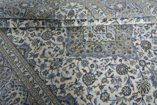 Close-up detail of 2000s Kashan rug from Iran / Persia showing Wool weave