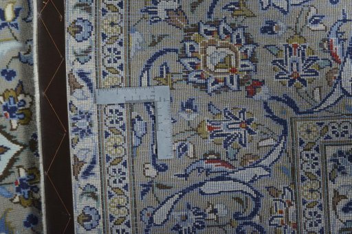 Backside of handmade 2000s Kashan rug showing knot structure and weave density