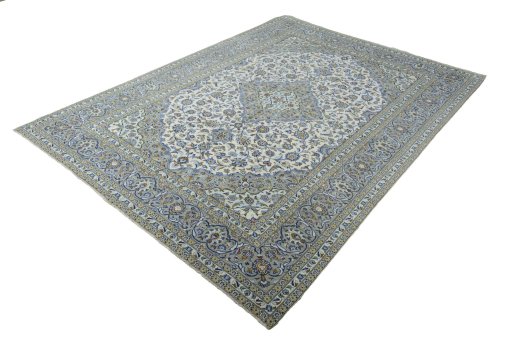 Corner detail of 2000s Kashan rug showing border pattern and Wool pile