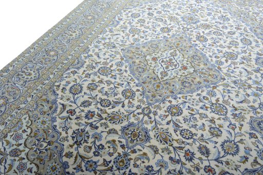 Backside of handmade 2000s Kashan rug showing knot structure and weave density