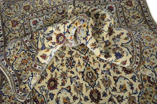 Backside of handmade New Kashan rug showing knot structure and weave density