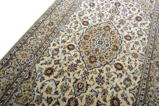 Backside of handmade New Kashan rug showing knot structure and weave density