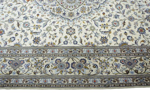Corner detail of New Kashan rug showing border pattern and Cork pile
