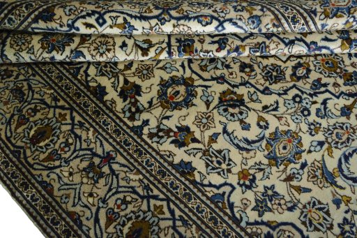 Close-up detail of 2000s Kashan rug from Iran / Persia showing Wool weave