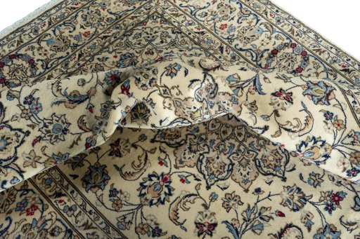 Surface texture of 2000s Kashan rug with natural Wool and intricate pattern