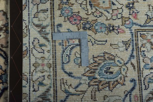 Backside of handmade 2000s Kashan rug showing knot structure and weave density