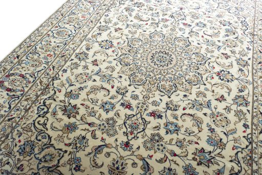 Backside of handmade 2000s Kashan rug showing knot structure and weave density