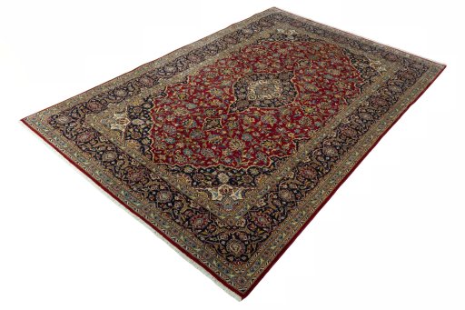 Corner detail of 2000s Kashan rug showing border pattern and Cork pile