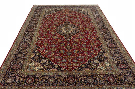 Surface texture of 2000s Kashan rug with natural Cork and intricate pattern