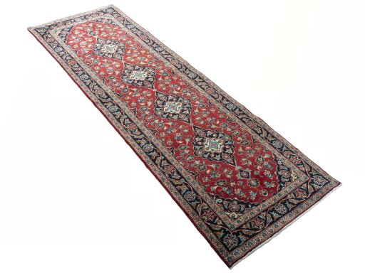 Close-up detail of 2000s Kashan rug from Iran / Persia showing Wool weave
