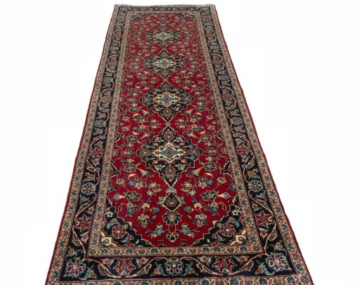 Surface texture of 2000s Kashan rug with natural Wool and intricate pattern