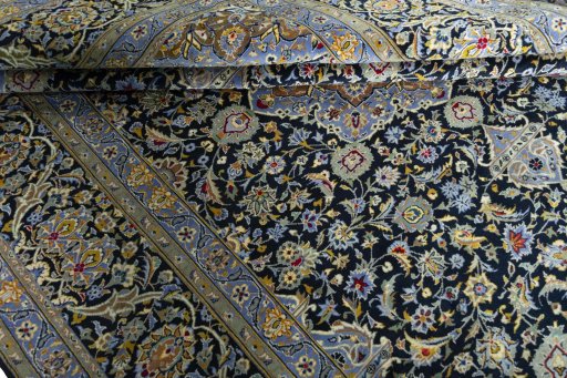 Corner detail of New Kashan rug showing border pattern and Cork pile