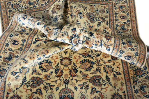 Surface texture of 1970s Kashan rug with natural Wool and intricate pattern