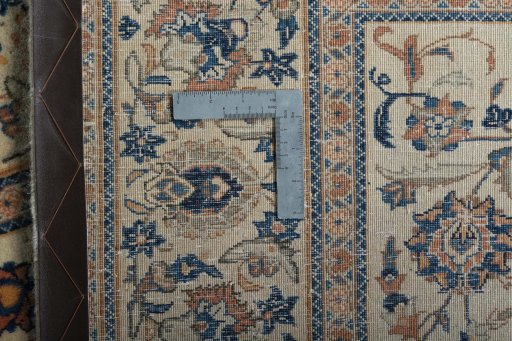 Backside of handmade 1970s Kashan rug showing knot structure and weave density