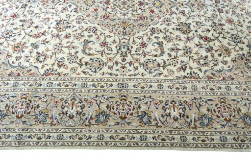 Corner detail of 2000s Kashan rug showing border pattern and Wool pile
