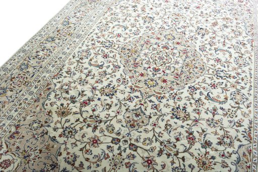 Backside of handmade 2000s Kashan rug showing knot structure and weave density