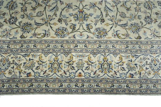 Corner detail of New Kashan rug showing border pattern and Cork pile
