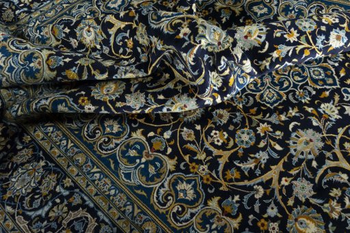 Surface texture of 2000s Kashan rug with natural Wool and intricate pattern