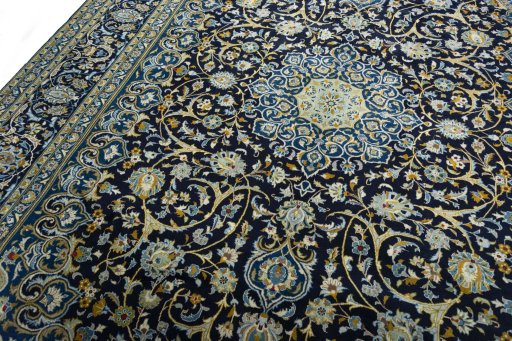 Backside of handmade 2000s Kashan rug showing knot structure and weave density