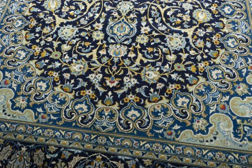 Close-up detail of 2000s Kashan rug from Iran / Persia showing Wool weave