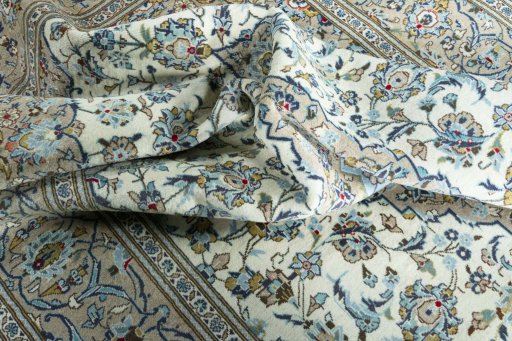 Surface texture of 2000s Kashan rug with natural Wool and intricate pattern
