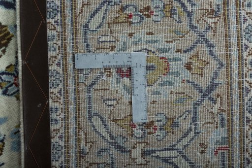 Backside of handmade 2000s Kashan rug showing knot structure and weave density