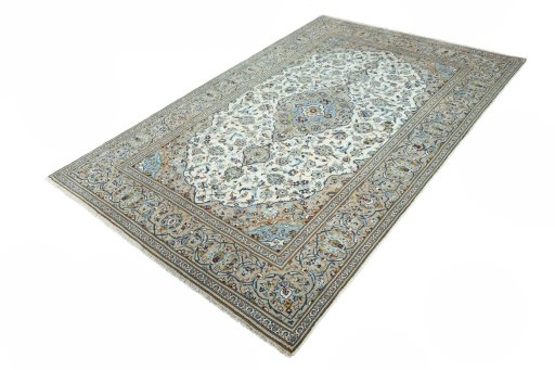 Corner detail of 2000s Kashan rug showing border pattern and Wool pile