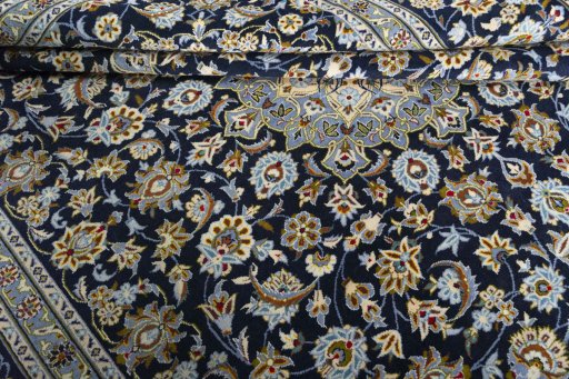 Close-up detail of 2000s Kashan rug from Iran / Persia showing Wool weave