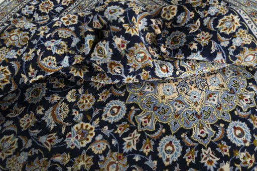Surface texture of 2000s Kashan rug with natural Wool and intricate pattern