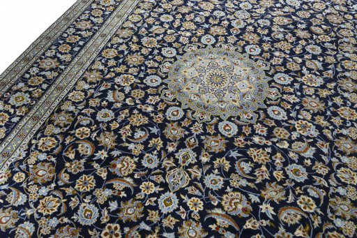 Backside of handmade 2000s Kashan rug showing knot structure and weave density