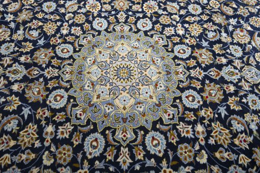 Central medallion detail of 2000s Kashan rug from Iran / Persia
