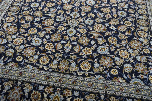 Close-up detail of 2000s Kashan rug from Iran / Persia showing Wool weave