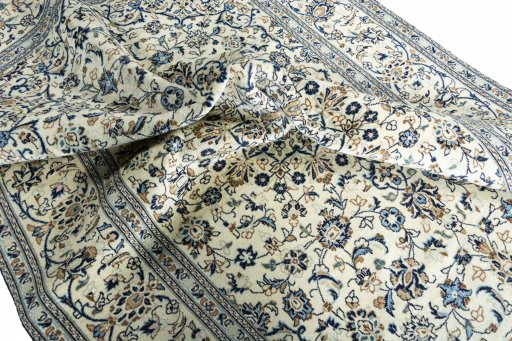 Surface texture of 2000s Kashan rug with natural Wool and intricate pattern