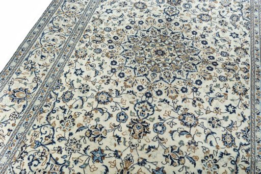 Backside of handmade 2000s Kashan rug showing knot structure and weave density