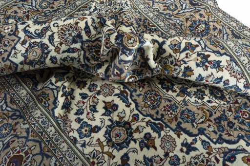Surface texture of 2000s Kashan rug with natural Wool and intricate pattern
